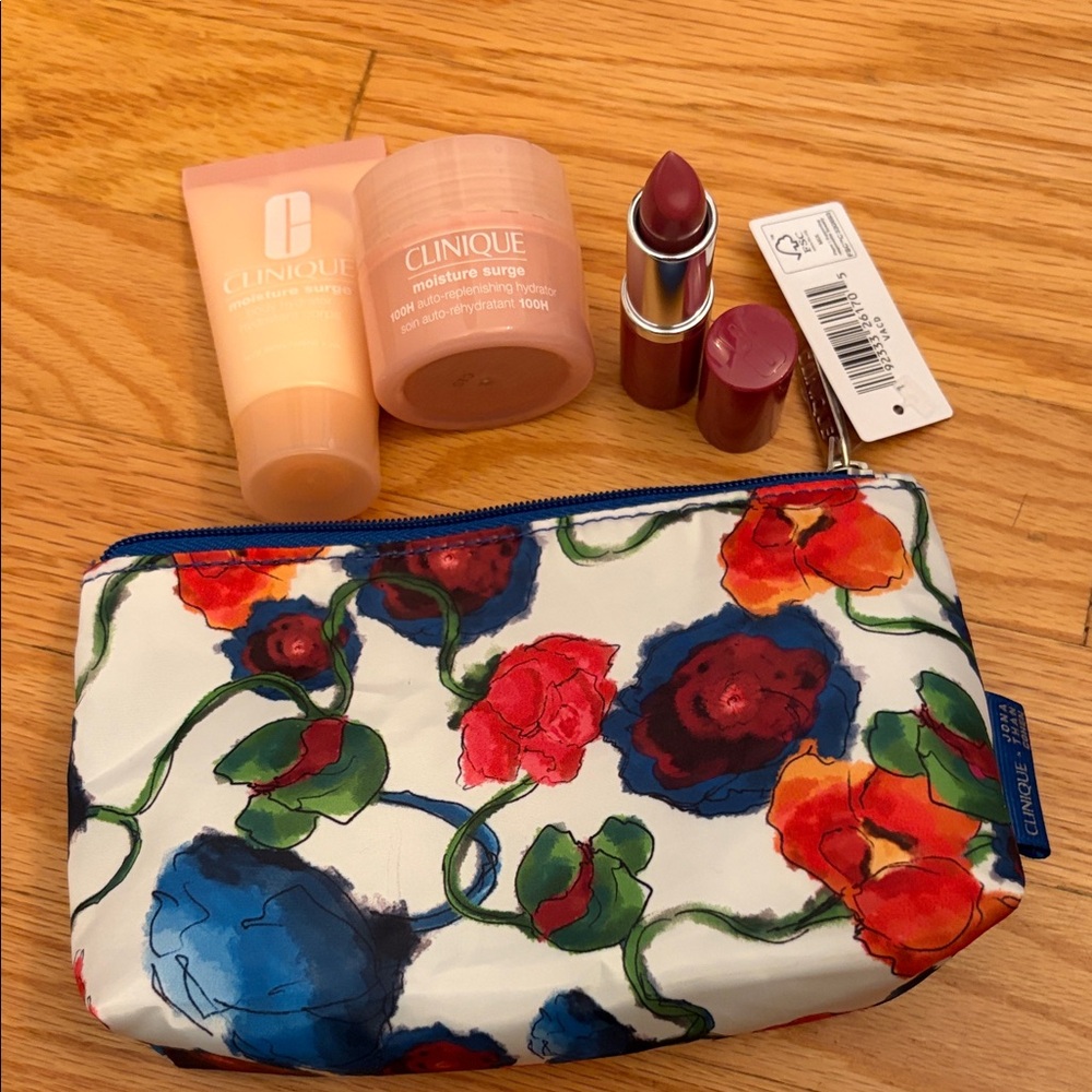 Clinique bundle of 4 Lipstick-moisturizer,body moisturizer and make up bag